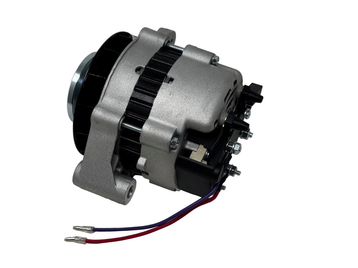A used automotive alternator with a silver metal housing, black ribbed pulley, and two wires (red and blue) with metal connectors, photographed on a light gray surface.