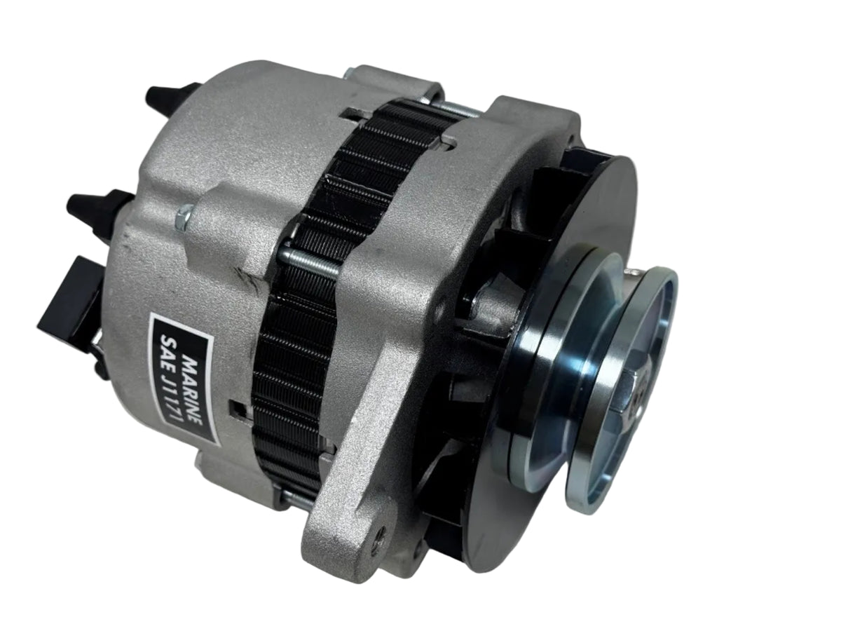 A used marine alternator with a silver metal housing, black ribbed belt cover, and a blue-tinted pulley, shown on a light gray surface.