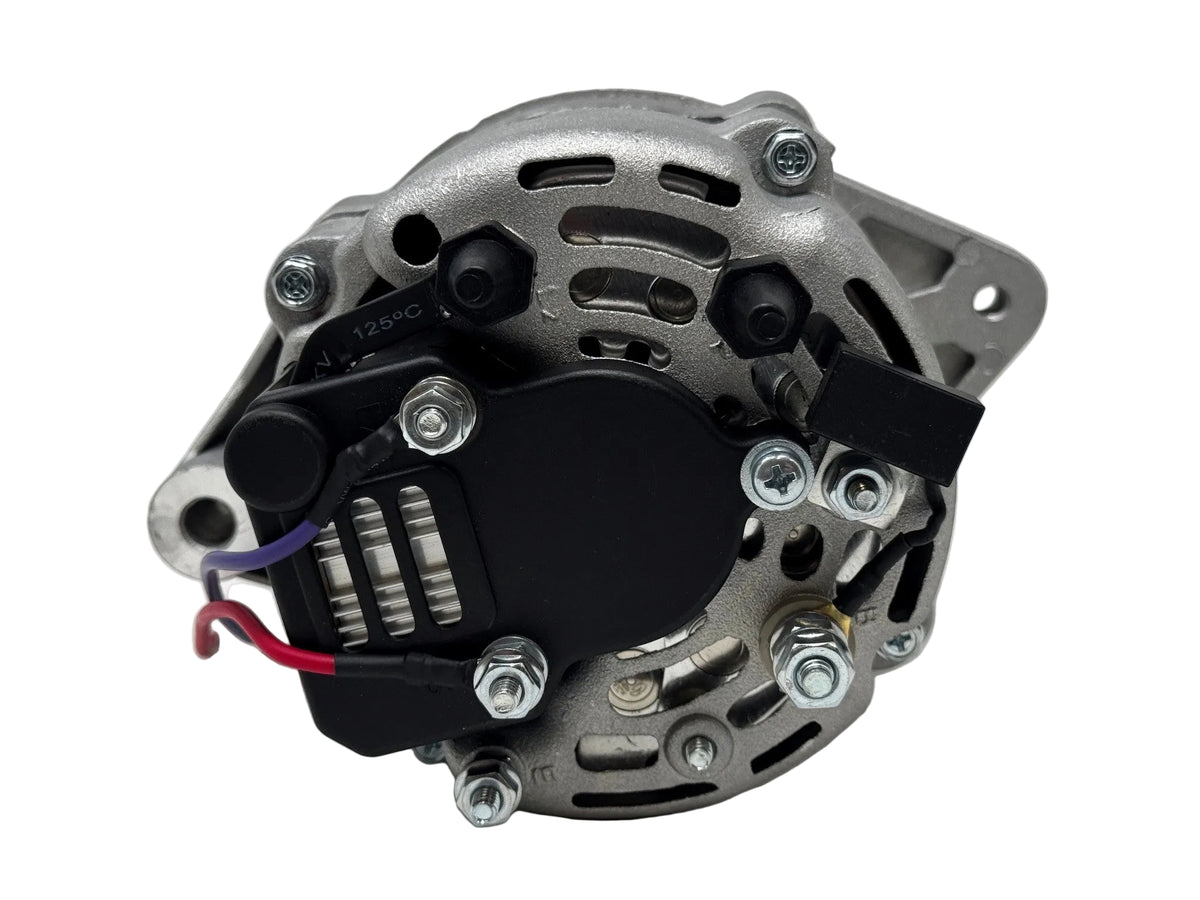 A used automotive alternator with a silver metal housing, black pulley and bracket assembly, and attached red and purple wires, photographed on a white background.