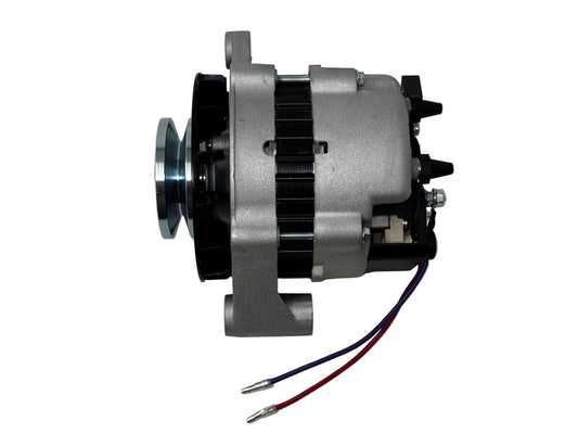 A used automotive alternator with a silver metal body, black pulley and internal components, and two wires (red and blue) extending from the side, photographed on a light gray surface.