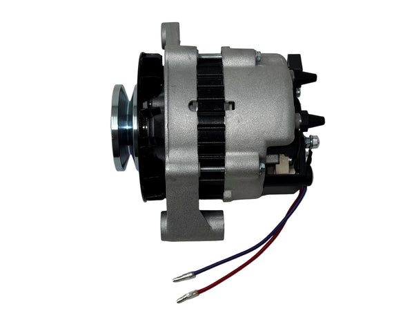 A used automotive alternator with a silver metal body, black pulley and internal components, and two wires (red and blue) extending from the side, photographed on a light gray surface.
