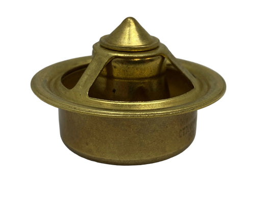 A gold-colored metal marine thermostat against a white background.