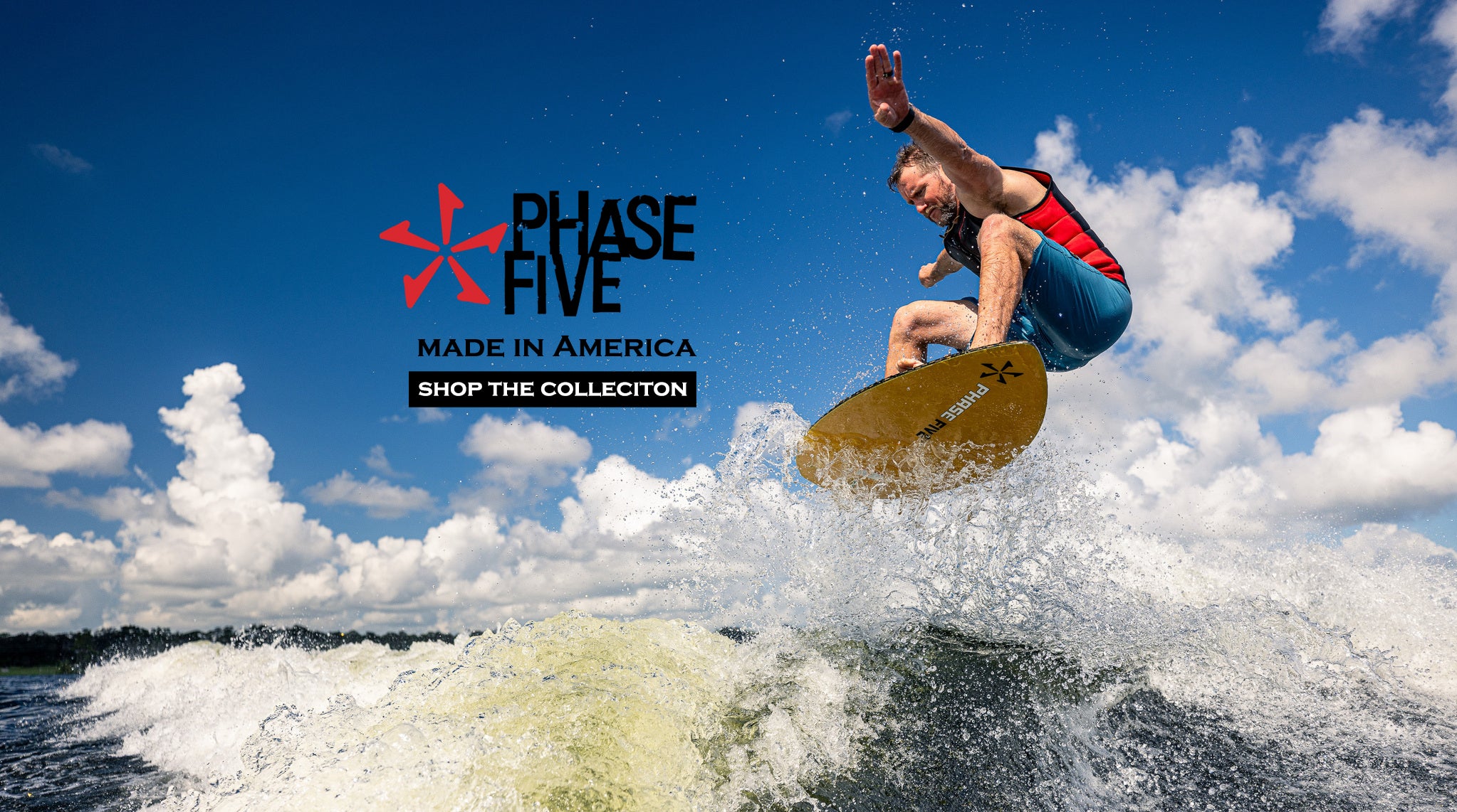 Person surfing with Phase Five branding in the background