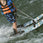 Child learning to water ski on Radar Firebolt combo skis