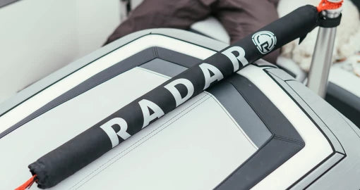 Radar rope protector positioned over an inboard ski boat motor box