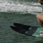 Recreational skier riding Radar X-Caliber combo water skis behind a boat