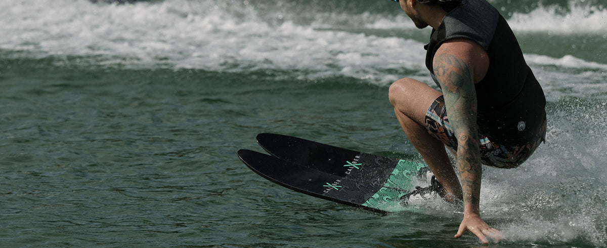 Recreational skier riding Radar X-Caliber combo water skis behind a boat