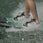 Recreational skier riding Radar X-Caliber combo water skis behind a boat