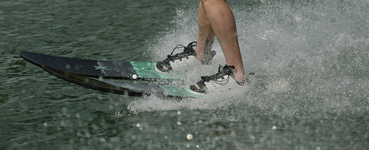 Recreational skier riding Radar X-Caliber combo water skis behind a boat
