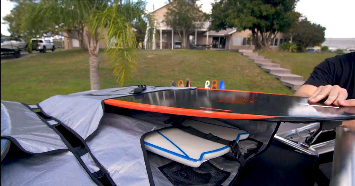Ronix four-board wakesurf carrier mounted to a boat Bimini top