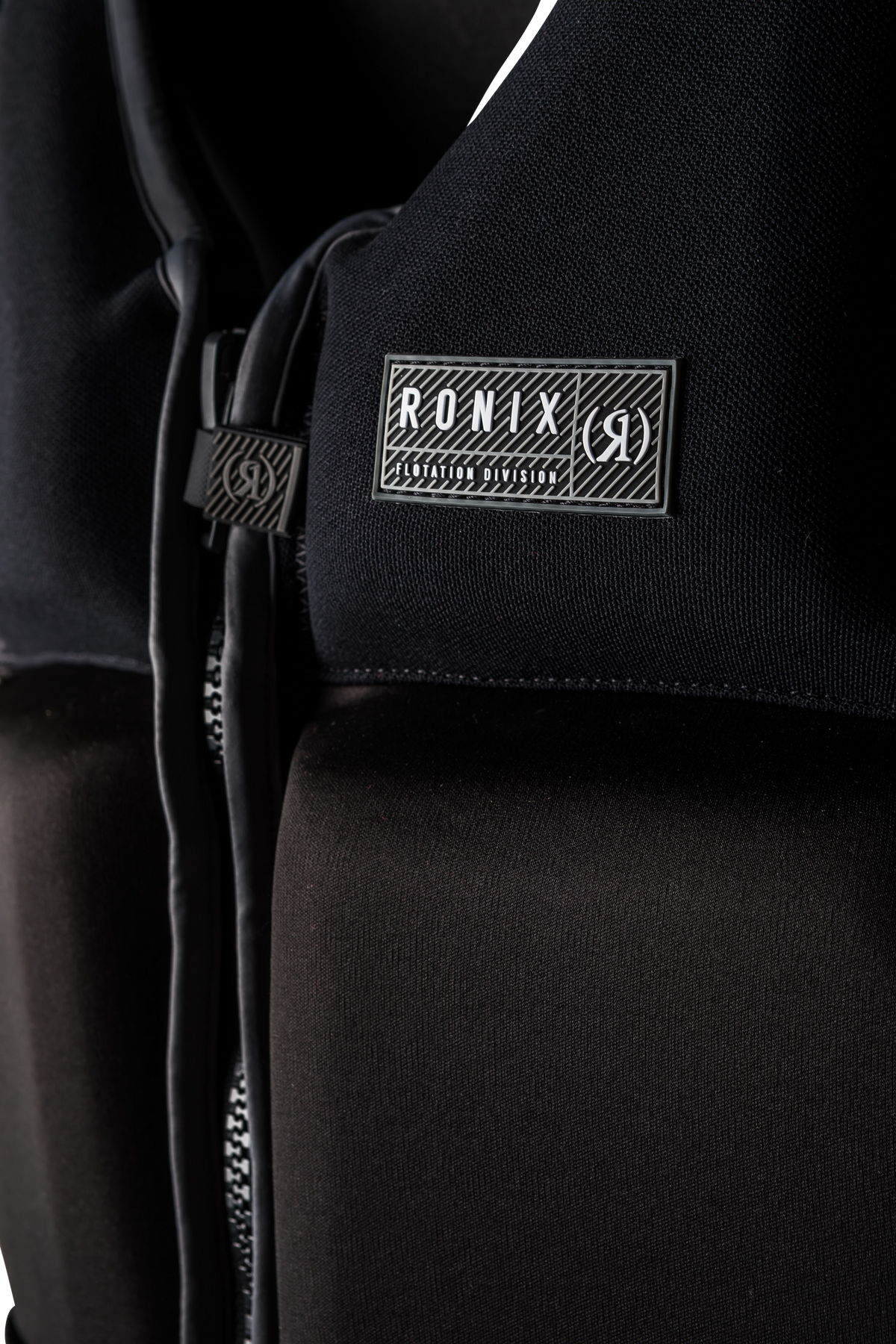 front view of Ronix Koal Capella 3.0 Coast Guard Approved life vest with logo and zipper