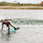 Female rider wakeboarding behind a boat on the Ronix Krush