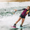 Female rider wakeboarding behind a boat on the Ronix Krush