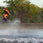 action shot of woman on a ronix wakeboard with the Ronix Luxe wakeboard boots